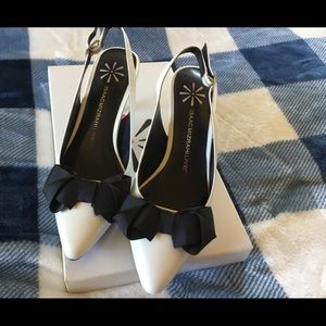 Darling White with black bow sling back pumps